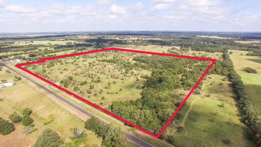 If you're looking for open skies, country living, prime real estate & no city taxes, look no further!  This 63.5 acres of picturesque land, located in the heart of the Ola Community, has approx 1789' of road frontage and no flood plain. The possibilities are endless! 7 miles east of Kaufman, 8 miles to Hwy 175, 15 miles to I 20, and 17 miles west of Canton on Hwy 243, this central location is ideal for any type of development offering a short drive in any direction to shopping, dining, schools, and hospitals.  When you realize you're out of bread, and don't want to drive to town or you are out of fuel for your 4 wheeler or side by side, your're in luck.  The Ola Store is within walking distance and a Dollar General is only 5 minutes away.  This property is gated, and has lots of trees and a pond, simply adding beauty to the majestic layout.  There's also a concrete building on the property that can be used for storage. If you're dreaming of a property that can become your own private sanctuary or maybe evolve into a commercial venture, you've found it!  Schedule your tour today.