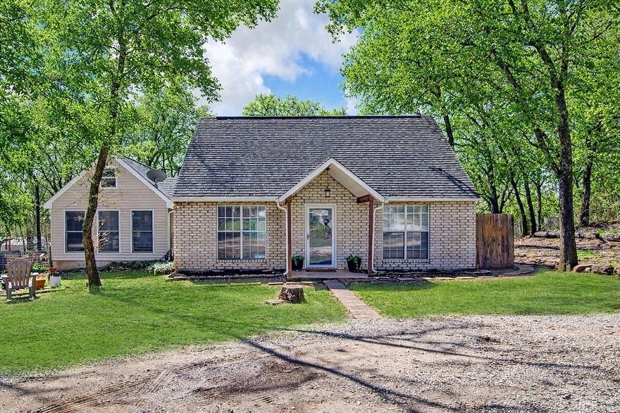 Priced to sell! Adorable 3 bedroom, 3 FULL bathroom home sitting on almost half an acre with mature trees and a beautifully landscaped yard. The primary bedroom is located downstairs and features a huge ensuite bathroom with a garden tub and separate shower. The open kitchen offers plenty of storage and flows nicely into the living area, making it great for everyday living and entertaining. Upstairs you’ll find two additional bedrooms with a full bath in between, offering a great layout for family or guests. The property also includes an oversized double carport perfect for large vehicles or even boat storage. Located outside the city limits in a lovely country neighborhood, yet still close enough for an easy commute to the DFW Metroplex. Plenty of room for your growing family this one won’t last long!