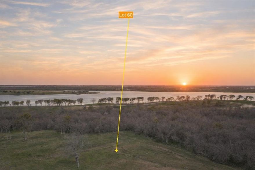 Welcome to Lot 60—just over 3 beautiful acres tucked inside the gated community of Barefoot Bay and only minutes from Corsicana. This off-water lot sits elevated above Lake Halbert at the end of a quiet cul-de-sac, giving you a peaceful setting, plenty of mature shade trees, and lots of room to spread out and build exactly what you’ve been dreaming of. While you’re not directly on the water, you’re still just steps away from the lake and all the fun that comes with it. Residents enjoy access to a private boat slip and ramp, making it easy to get out on the water whenever the mood strikes. Barefoot Bay also offers a clubhouse with a pool, fitness room, outdoor gathering spaces, and a fire pit—perfect for relaxing or entertaining friends and family. Imagine summer afternoons by the pool, evenings spent boating, and quiet sunsets enjoyed right from your own backyard. With shopping, dining, and entertainment in Corsicana just minutes away, this lot offers the perfect balance of peaceful country living and everyday convenience. It’s a wonderful spot to put down roots and enjoy lake life at your own pace.