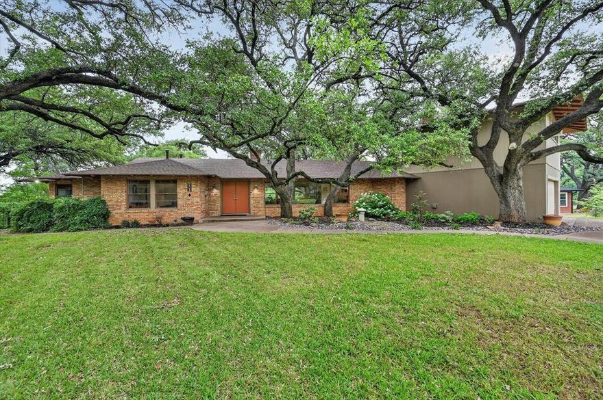 Nestled beneath mature trees on a spacious .41-acre lot in Historic Oakhurst, 2039 Lotus Ave is a beautifully preserved 4-bedroom, 3.5-bath Mid-Century Ranch that blends timeless character with everyday comfort.
Inside, you’ll find original terrazzo floors, two fireplaces, a wet bar, and an abundance of built-in cabinetry showcasing both function and iconic mid-century design. The vintage Chambers oven and range remain fully functional, serving as a true centerpiece of the home. Thoughtfully maintained, the property retains its original charm while offering a warm, light-filled layout.
Step outside to lush landscaping and a private backyard retreat featuring a swimming pool perfect for relaxing or entertaining on the oversized lot.
A standout feature is the efficiency apartment above the garage, complete with a kitchenette and en suite bathroom—ideal for guests, rental income, or a private workspace.
Located just minutes from downtown Fort Worth, this rare offering delivers character, space, and versatility in one of the city’s most sought-after historic neighborhoods.