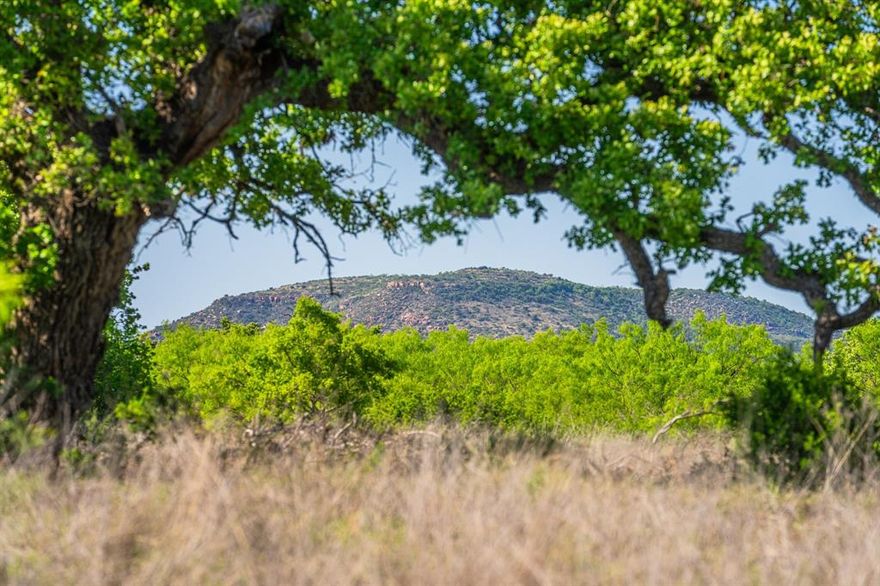 Mountain View Ranch offers a remarkable opportunity with its unique 272 acres. The ranch is conveniently located just 15 minutes west of Llano, one hour from Fredericksburg, and 50 minutes from Horseshoe Bay, with 2,780 feet of county road frontage and paved access directly to the ranch via Valley Springs Rd. The ranch features gently rolling terrain and stunning views enhanced by Live Oaks, Post Oaks, and mesquite trees, along with striking granite outcroppings, an attractive stock pond, and a few seasonal tanks. Recently added crushed granite gravel roads provide easy access throughout the ranch. A modern Stella Domo 764 sq ft tiny home offers comfortable and convenient living amidst the ranch's natural beauty. Scenic draws and cleared native underbrush have created excellent pastures and rangeland, perfect for both wildlife and cattle. Llano is well known as the Deer Hunting Capital of Texas making this ranch appealing for hunting in the Texas Hill Country. Common wildlife sightings include Whitetail Deer, Rio-Grande Turkey, Wild Boar, Bobcat, Red & Grey Fox, Ring-Tailed Cat, Raccoons, Armadillo, and Red-Tailed Hawk. With a significant portion of the ranch remaining untouched, the new owner will have the opportunity to create their vision for this exceptional ranch.