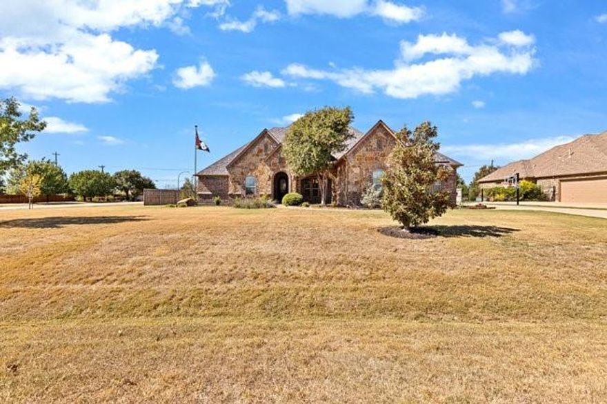 This beautiful 5-bedroom, 3-bath home has it all! Step inside to find hand-scraped wood floors, vaulted ceilings, and a floor-to-ceiling stone fireplace surrounded by custom built-ins. The open-concept floor plan is perfect for entertaining family and friends.  The luxurious primary suite features an ensuite bathroom with a walkthrough shower and dual shower heads, a relaxing jetted tub, dual vanities, and an oversized closet with floor-to-ceiling built-ins.  The chef’s kitchen offers stainless steel appliances, a gas cooktop, and a spacious walk-in pantry. The fifth bedroom is versatile—ideal for a second master suite, game room, or home office.  Step outside to your private backyard oasis featuring an outdoor kitchen, fireplace, and a sparkling saltwater pool with a tranquil water feature. Perfect for year-round enjoyment!  Located within walking distance of a beautiful community park, this home truly combines luxury, comfort, and convenience.