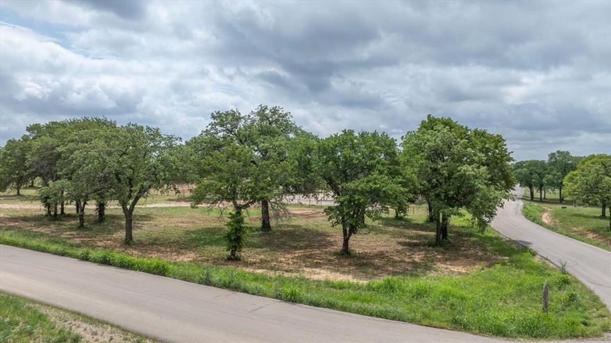 Build your dream home on this 2-acre corner lot in Santana Ridge Estates, a community within the acclaimed Brock ISD that offers acreage lots, room to spread out, and a country lifestyle close to town. The property features gently rolling terrain with scattered mature trees, providing a scenic setting for your custom build. There’s ample space here for your horses, barn, or workshop—giving you the flexibility to create the property that fits your vision. Enjoy the quiet atmosphere of Parker County while still being just minutes from Weatherford, Teskey’s, dining, and shopping. Lots in Santana Ridge are limited, making this a rare chance to design a home and lifestyle that blends country living with everyday convenience.