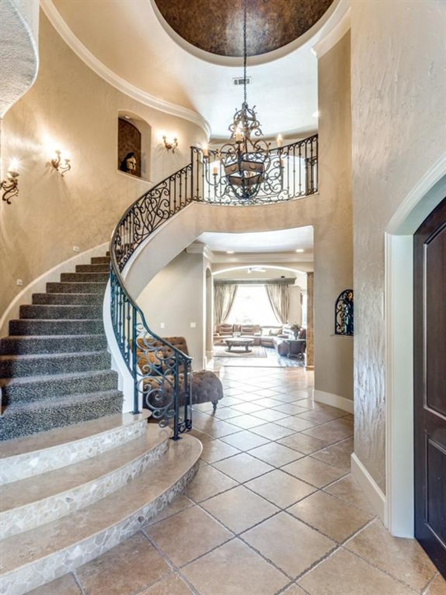 Exquisite Home- Gated Community- 6 Ensuites. Perfect multi-generational home if needed . Beautifully Built Tuscan Architecture. Sweeping Staircase entry. Chef's Gourmet Kitchen- Thermador-Double Ovens, 5 Burner Gas Cooktop- Grill & Griddle, Built-in Microwave, Warming Drawer. Seated bar area-& also use as serving area. Elegant Dining Room soaring ceilings -Coffered Wood Beam Accent, 12 inch ornamental Crown Moldings. Great Room with -32 ft ceilings.Floor-Ceiling Windows. Open view to 2nd floor. Juliet Balcony overlooks Great Room. Luxuious Crown Moldings Luxurious Master Suite- sitting area-Juliet Balcony. Master bath-2 vanities-built in Cabinets. Huge Closet. Laundry Rms-1st & 2nd floors. Game room-looks out on pool. Inside-Private living quarters (see floor plan)-outside entrance-side yard-Patio. Garage Access. Park-Like backyard- Covered Patio area-with Gas Fireplace. Beautiful Pool-Spa has fountain. 4 Car-Garage. Secure access to Trinity Trails. Need POF to visit.