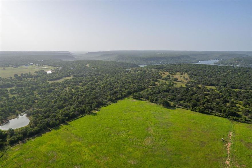 +- 100 acres of beautiful agriculture land in the heart of the North Texas Hill Country. There is an abundance of wildlife including deer, pigs, coyote, fox, turkey, and dove, to name a few. Located just minutes from Lake Palo Pinto marina and boat dock.  Enjoy the beautiful Texas sunsets looking over the hills of Palo Pinto. This property would make a great high fence ranch or could be developed.  The land is currently being used for running cattle.  There is at least one stock tank. There are two access points off N Lakeview.  Construction on Turkey Peak Reservoir is scheduled to begin March 2025.  Growth will be coming to this area.  Land will come out of a larger parcel and needs to be surveyed for exact acreage.
