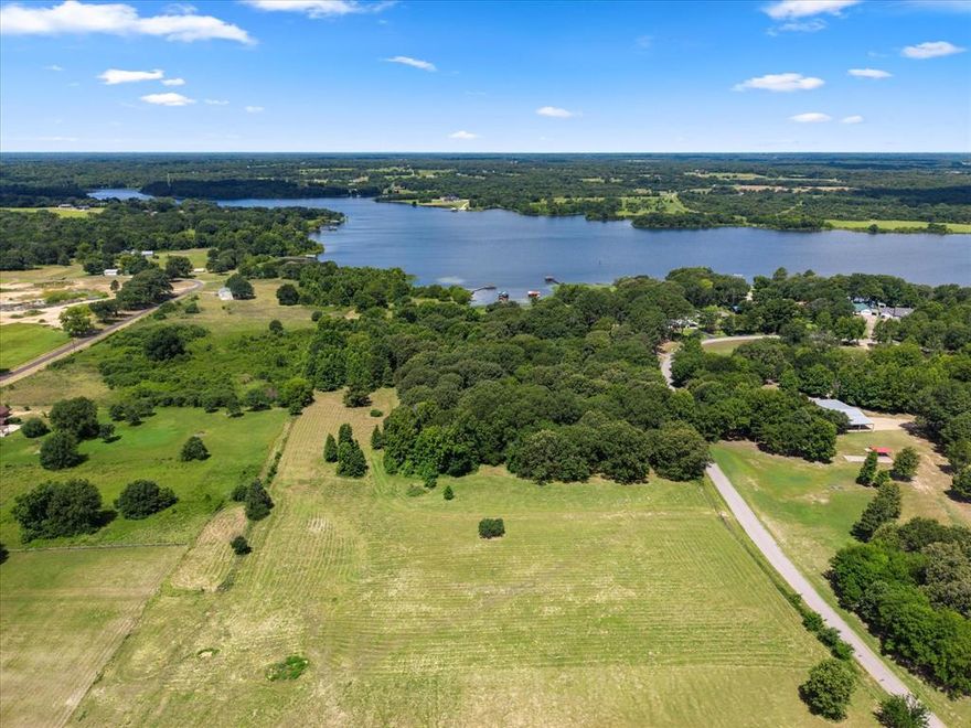 RARE OPPORTUNITY! Looking for waterfront property on famous Lake Fork? This 7.810 deeded acreage plus 5.163 of leaseback is located next to Arrowhead subdivision and Dale Creek Cove. Electric is on site, water is close by.  There are no restrictions HOA and there is boat ramp close by to access the water. Go build your dream home!