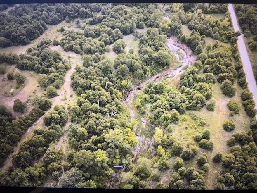 29.25 Acres – Scenic, Versatile Land with Water & Fencing

Discover the perfect blend of natural beauty and functionality on this 29.25-acre property. Featuring a mix of grazing areas and mature trees, the land offers privacy, shade, and excellent potential for a homesite or recreational use. Rolling hills provide beautiful elevation changes and long-range views, while a seasonal creek winds through the property—ideal for livestock, wildlife, or simply enjoying nature. There is even a pond that was partially been dug that just needs some TLC for year-round use.

A registered water well is already in place, and the property is fenced on 3 sides. Whether you’re dreaming of a rural retreat, small ranch, or a private getaway, this land checks all the boxes.