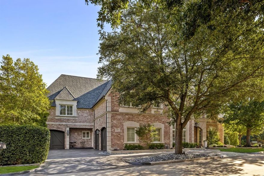 Nestled within the prestigious, guard-gated community of Glen Abbey, this exquisitely crafted 6-bedroom, 6.2-bath estate by Hawkins-Wellwood Homes blends timeless architecture with elegant, soft contemporary styling. Set among mature trees along a peaceful creek, this 6,998-sq-ft residence was refreshed and remodeled in 2022 under the design direction of Jennifer Colby Interiors.

Step inside to find 25ft vaulted ceilings, custom wood rafters, a dramatic living room with an elegant stone fireplace, and a gourmet kitchen reimagined with Wolf and Sub-Zero appliances, designer quartzite counters, custom cabinetry, and Entek hardware. The first-floor primary suite is a sanctuary with 15-ft ceilings, dual walk-in closets, and a spa-inspired bath opening to the patio.
Smart-home features include Control4 automation, Lutron dimmers, built-in speakers, AppleTVs, and phone-controlled lighting, sprinklers, and security. Enjoy resort-style outdoor living with a saltwater pool and spa, covered patio with fireplace and electric screens, and a detached cabana featuring a Viking chef’s kitchen and bar—all surrounded by lush, creekside landscaping.

Additional highlights: new roof (2023), soft-water system, extensive millwork, and a 3-car garage. Glen Abbey offers a private fitness center, water features, and convenient access to Bent Tree Country Club nearby. Families will also enjoy convenient access to Trinity Christian Academy, Prestonwood Christian Academy, and Parish Episcopal. This is luxurious executive living in one of North Dallas’s most exclusive enclaves.