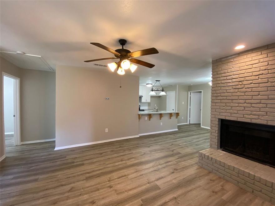 Must See! Beautiful fully updated three bedroom two bath duplex in Mansfield ISD. Fashionably updated with light gray interior paint. Kitchen features new black and stainless steel appliances, new cabinets with granite granite countertops in kitchen & both bathrooms. Wood burning fireplace. Privacy fence. Storage shed. Rear carport for two car parking.