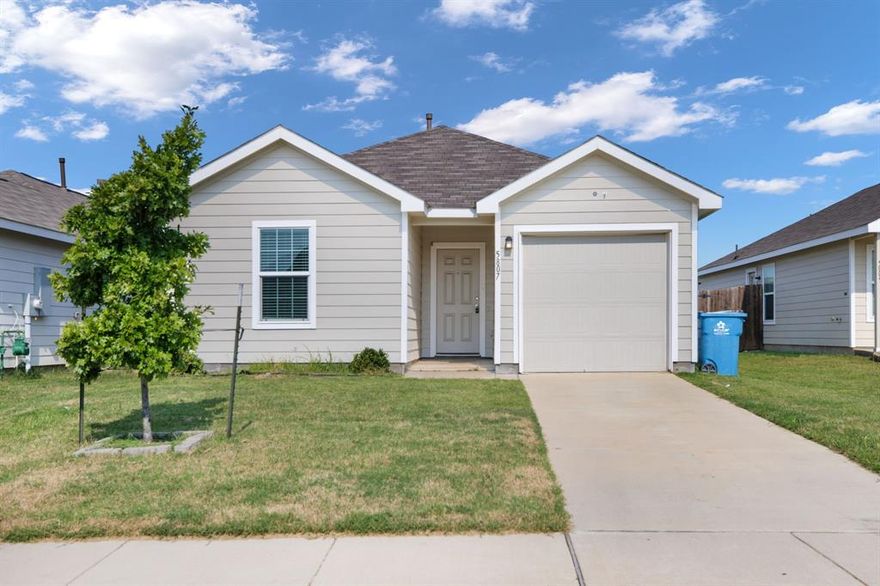 This charming 3-bedroom, 2-bathroom home offers a bright and modern living space in a quiet Forney neighborhood. The open floor plan features a spacious living room with plenty of natural light, a kitchen with dark cabinetry, solid countertops, and black appliances including a gas stove, dishwasher, and microwave. The bedrooms are generously sized, and both bathrooms are clean and updated with modern finishes. Step outside to a private fenced backyard that’s perfect for outdoor living, pets, or weekend gatherings. The one-car garage and driveway provide convenient parking. The property is part of an HOA, which helps maintain the neighborhood and offers community standards. Forney is one of the fastest-growing communities in North Texas, known for its small-town charm with easy access to Dallas. The home is close to neighborhood parks, schools, and local shopping. Commuters will appreciate quick connections to Highway 80 and I-20, making travel to Dallas or surrounding cities easy.