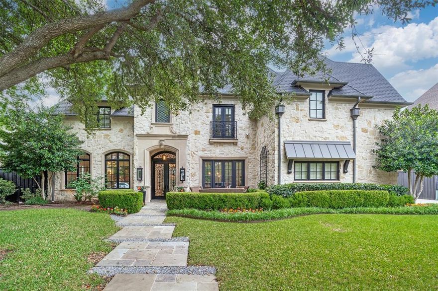 Located in the highly sought-after Fairway of Preston Hollow, 6430 Stefani Drive is a beautifully remodeled luxury home in one of Dallas’ most prestigious neighborhoods. Built by Danes Custom Homes and extensively updated in 2022, this 7,557 sq ft residence sits on a .413-acre interior lot in a prime Preston Hollow location near Preston Center, NorthPark Center and Preston Royal, with convenient access to the Dallas North Tollway and Central Expressway. With 11' ceilings on the main level and 10' ceilings upstairs, the home is light-filled and airy, blending grand scale with everyday comfort. Designed for entertaining and modern living, the open floorplan features a remodeled kitchen with quartz and quartzite countertops, new Sub-Zero refrigerator and freezer, large walk-in pantry, and seamless flow into a gracious living area with cathedral beamed ceiling and gas fireplace. The formal living room is filled with natural light and anchored by a two-way fireplace shared with a paneled private office, while a second office downstairs offers ideal work-from-home flexibility. The oversized primary suite is a private retreat located on the main level, offering space for a sitting area and a beautifully remodeled spa-like bath with dual vanities, soaking tub, large walk-in shower and expansive closet. A guest suite is also conveniently located downstairs. Additional main level highlights include a wet bar with new ice maker, wine room, and a large utility room.
Upstairs features three generously sized ensuite bedrooms with large closets, along with a game room, exercise room and a golf simulator room that can easily convert to a media room. Outdoor living includes a covered patio with fireplace and outdoor kitchen overlooking a pool with fountains and turfed yard, ideal for year-round enjoyment. Additional features include hardwood floors, 3-car garage with EV charger, 2022 roof, proximity to top private schools, and a whole-home generator installed in approximately 2022.