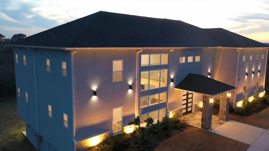 SAY YES TO THE ADDRESS!
This 2023 Build 3-STORY ESTATE inside a GATED COMMUNITY with RELAXING LAKE VIEWS is designed for the lifestyle you’ve been dreaming of. Recently appraised above asking, it gives you the rare advantage of INSTANT EQUITY. With over 8,300 sq ft, this home offers 6 BEDROOMS and 6 BATHROOMS, including a PRIVATE IN-LAW SUITE perfect for family or guests. The finished lower level invites you to entertain with a WINE CELLAR, THEATER ROOM, SAFE ROOM, and full bath. Upstairs, the PRIMARY SUITE feels like a retreat with its WRAP-AROUND BALCONY, WET BAR, private gym, study, and a CLOSET THAT RIVALS A BOUTIQUE. Thoughtful touches like an ENERGY-EFFICIENT DESIGN, EV CHARGER, and OVERSIZED 3-CAR GARAGE ensure this home is as practical as it is luxurious. From first look to final detail, this home was built for you.