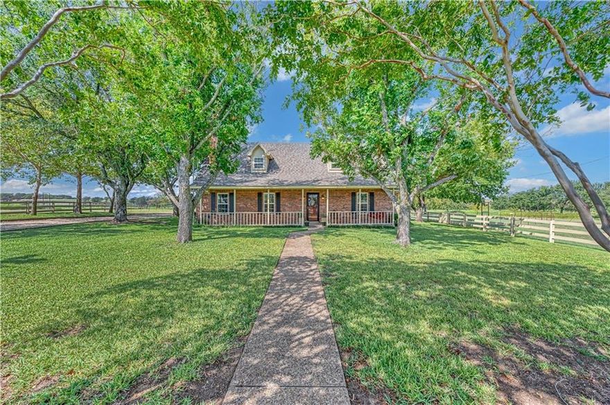 Country roads, take me home… to this beautiful picturesque property in the heart of Central Texas!!  This 3 bedroom, 2 bath home is located on the outskirts of Waco in the quaint, historic town of McGregor. So much southern charm in this solid-built, two-story house nestled among mature oak and pecan trees. It has been lovingly cared for and owned by the same family since it was custom built. The home has a spacious, fully screened back patio area to enjoy those amazing sunset views in any weather. Enjoy the sunrise on crisp mornings from the expansive front porch settled in a rocking chair with some coffee.  With over 8 fenced acres, there is plenty of room for livestock or 4H/FFA projects. This land will not disappoint with its manicured pastures and stock pond. Pond also has a pump and irrigation system to water the beautiful, mature pecan trees scattered across the property. Grow your own organic vegetables in the raised beds located just steps from the back patio area. There is a storage building that is also the perfect workshop for the hobby enthusiast. Bring the RV to park under the covered metal awning. Inside the home features spacious bedrooms, with the primary bedroom isolated downstairs. There are numerous updates throughout, including granite countertops and engineered hardwood floors. The living room features a wood burning stove to cozy up by on those wintry nights.  
Whether you are looking to escape to the quiet countryside or create your dream homestead, this property has endless possibilities. It truly is the best of both worlds being only 5 minutes from downtown McGregor with its cafes, antique shops, park, and train station. It is only 20 minutes to Hewitt/Woodway with an abundance of dining and shopping options from larger chain stores.
Schedule a visit to see the impeccable maintenance and care that this home has received.