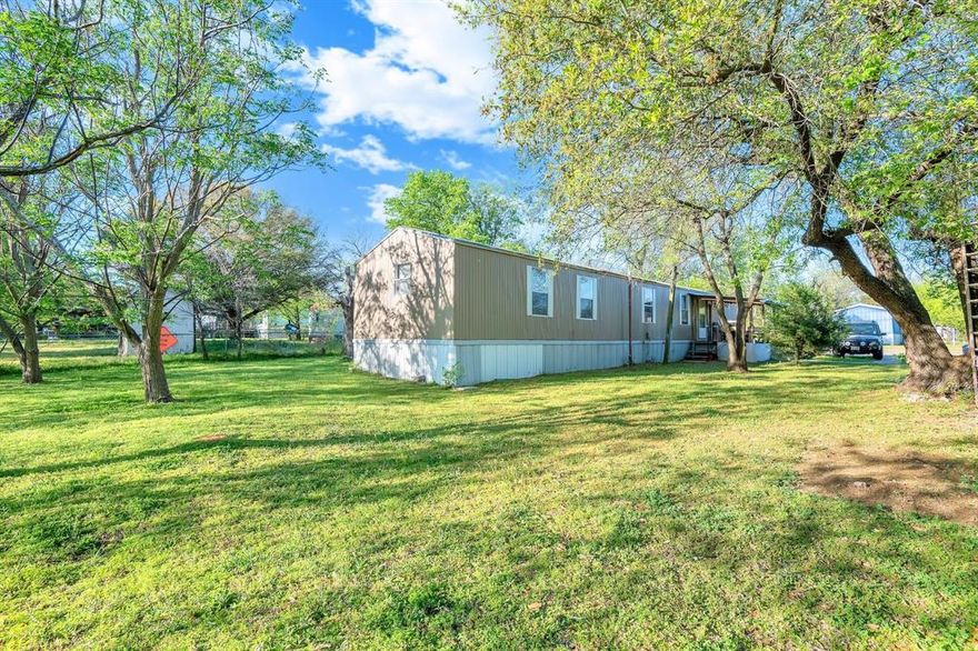 Keene a well maintained 3-bedroom, 2-bath mobile home situated on a 0.232-acre lot. The flexible floor plan includes a spacious living room and an eat-in kitchen, providing comfortable everyday living. Home features central air for year-round comfort, electric utilities, and low-maintenance metal siding. The sizable lot offers outdoor potential for gardening, play, or parking. Conveniently located near local schools, shopping, and commuter routes, this property presents an excellent opportunity for affordable homeownership or rental income.