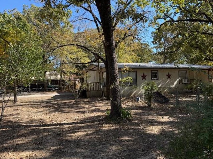 Peaceful 2 Acres with a Mobile Home, Covered RV Carport, 2 Storage Buildings, 3 Bedrooms and 2 Baths. Located within walking distance of Cedar Creek Lake. Convenient Boat Ramp, Fishing Pier and RV Park are just some of the amenities. Washer, Dryer and Refrigerator will remain with the home.
