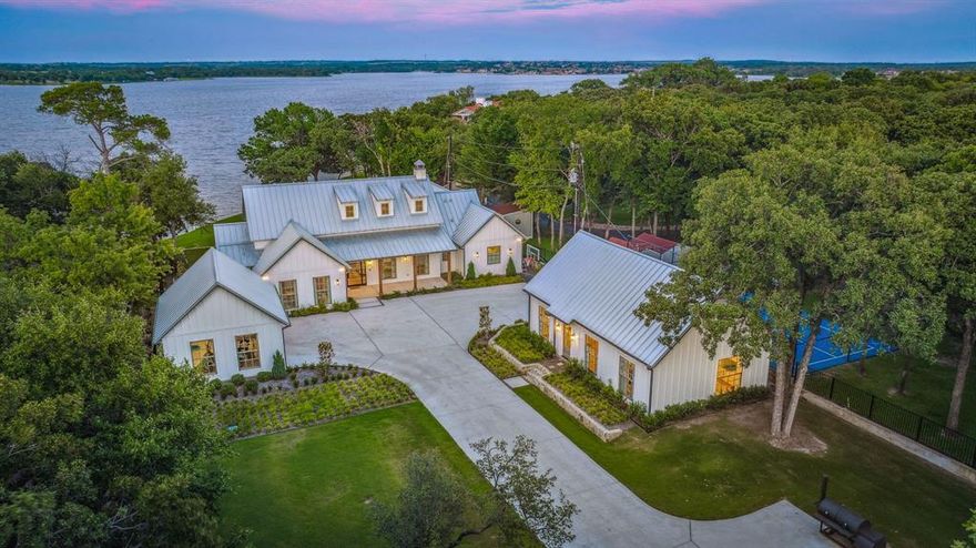 IT DOESN'T GET ANY BETTER THAN THIS - IT'S MILLER TIME! This private gated almost 1.2 acres of perfect sticker less, Botanic Garden like setting, complimented with a new home (also remodeled guest house) with almost 4700 sgft total, 6 bedrooms, 5 baths, and arguably on one of Eagle Mountain Lakes top 5 streets is ready to be made someone's new Estate. One of the top 2 or 3 newly built homes on the entire lake, WOW! From all rooms, drinking in the view including the dock, an iPad and coffee, never had a better setting. This new Eagle Mountain Lake property (Braswell Homes did it right) will put your attitude in full bloom, or can I dare say an Eagle Mountain High. A covered deck with an outdoor kitchen will help keep your weight up, overlooking a perfect pool party setting. The 'casual luxe' created from room to room is just a part of its majesty. Even hiking or walking on Miller Road is peaceful and safe compared to many streets on the lake. The dock at the motor has 10' of water as compared to the lake average of 7'. 175' of shore front gives extra elbow room as the lake average is 100'. The totally remodeled guest house is as sweet as 'Tupelo Honey'. This property wears the 'Peaceful Easy Feeling' lifestyle as it is tailor-made for the Eagle Mountain Lake enthusiast. Let the pictures speak for themselves. Come sit and admire the General Splendor of what nature and man can create together as you incorporate the Lake Lifestyle into your DNA. Better bring a drool towel as you Discover Additional Benefits Hidden in Plain Sight.