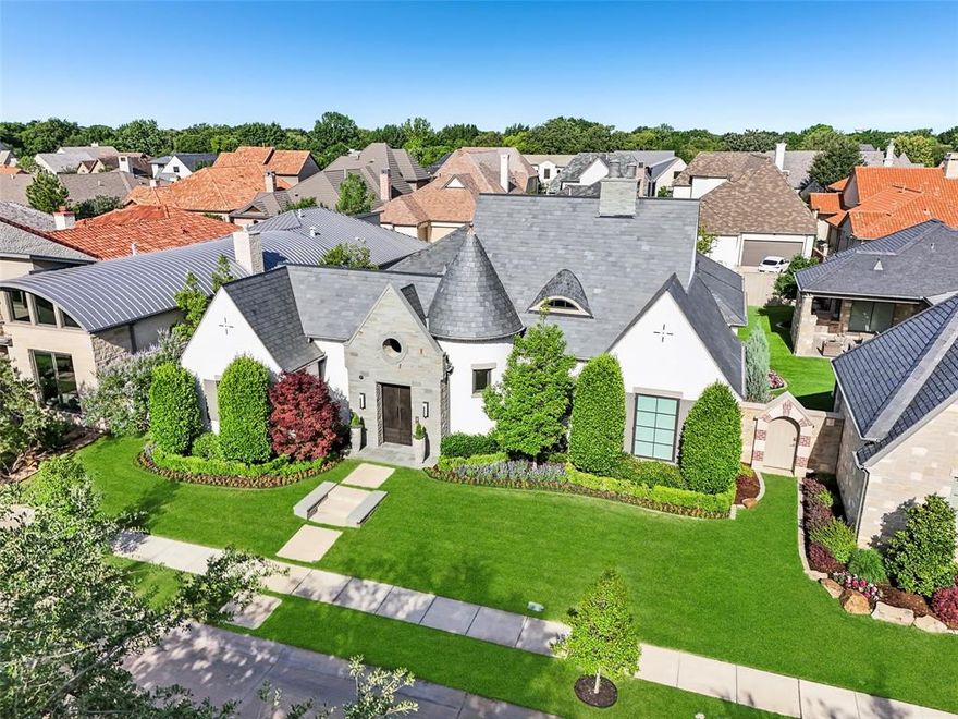 Rare architectural beauty in Coppell’s prestigious Red Hawk neighborhood blends modern design with elegance and high-end finishes throughout. The layout centers around a private courtyard with a lush garden and patio, offering views of green space from nearly every room. A second garden in the back enhances the home’s natural light and tranquil atmosphere. Interior highlights include designer lighting by Moooi, Studio Italia, LZF, and RH, plus custom doors such as unique Italian glass doors in the primary suite. The home features a semi-detached casita with a full en-suite bath, perfect for guests or extended family. The spacious primary bedroom and casita both offer high-end California Closets systems. A third large bedroom—currently a gym—rivals the primary in size. The gourmet kitchen boasts barrel ceilings, Miele appliances, a 6-burner range, and a built-in microwave convection combo. A separate butler’s pantry includes a wine fridge and cappuccino machine. The open-concept living and dining space impresses with 14-foot ceilings, rustic beams, and a sleek marble fireplace. Rare for Dallas, the home includes separate his-and-her offices, ideal for dual remote work. Additional standout features include:-A dream garage with California Closets storage and workspace - Large laundry room with built-in ironing board and pet nook - Whole-home surround sound, including the patio - Patio misting system for summer comfort - Three exterior security cameras with motion sensors and continuous recording - Foam insulation for energy efficiency and a built-in humidifier for winter Smart features like keycode video entry, plus stylish, functional touches throughout, make this home one of a kind. The home features a durable and refined slate roof, prized for its natural beauty, longevity, and timeless curb appeal. Truly, photos can’t capture its full charm—you have to see it in person.