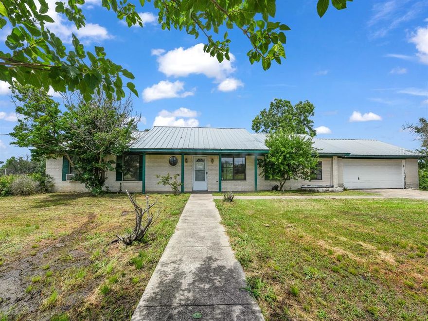 12 Gated Acres On Old Agnes Road With Easy Access To FM 51. Bring Your Horses And Livestock. Property Has A Secluded All Electric 3-2 Painted Brick Home With A New 2-Car 23X24 Attached Garage And 40X60 Metal Shop. The Home Has Large Formal Dining Area, Breakfast Nook With Bay Window, Large Utility Room And Unfinished Bonus Room. Kitchen Has New Wall Oven That Has Never Been Used, Electric Cooktop, And Pass Through Feature To The Living Room That Could Serve As A Breakfast Bar. Living Room Is Large With Beamed Cathedral Ceiling, Wood Burning Brick Fireplace And Extra Long Raised Hearth. Over Sized Windows Through-Out Provide Lots Of Natural Light, Central Heat And Air But Seller Used Window Units The Last Several Years. Extended Covered Front Porch And Covered Back Patio. New 40X60 Shop Is Perlin Metal With Electric, Custom Shelving, Tandem Roll-up Doors And Carport On The Back. Property Is Fenced And Cross Fenced. There Is A Seasonal Tank, 2 RV Carports, Dog Runs And Fenced Garden Area. All Buildings Have Metal Roofs. This Property Is On A Well And Septic And Has High-Speed Internet Available. The House Is In Need Of Updating And There Is No Survey Available. This Is A Must Show Property For Someone Looking For A Little Farm Close To Weatherford With That Privacy Feel.