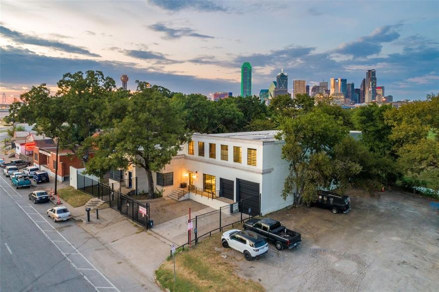 Exceptional one of a kind 2 story 8,046 sq. ft. commercial building that has a 4,100 sq. ft. roof deck with stunning downtown skyline & park views backing directly to a new 17 acre wetlands $50M park behind 1212 in progress Dallas Water Commons. Also located across the street from the $325M Trinity River 250 acre park. 1212 S. Riverfront Blvd. was restored to perfection 2018 with upscale finishes throughout while keeping the historic character with original brick walls, open rafter vaulted wood ceilings, walls of warehouse windows. & concrete floors throughout. Open floor plan with multiple offices, sound proof recording studio, 2 full chefs kitchen, 5 baths, balcony & roof deck with fantastic views! 2018 TPO roof & 4 Carrier HVAC, tankless hot water, Gated parking. 2 car attached garage, loading area, & a hydraulic lift to the 2nd level. Fantastic Zoning allows 240 foot height with no side or rear set backs. New developments near by include new $3.7 Billion Dallas Convention Center renovation & expansion, Hunt $5B Reunion Tower renovation, Texas Central Bullet Train Station less than 1 mile away, Columbus Realty 47 acre mixed use development at 504 Riverfront Blvd. , Longhorn Ballroom 6,000 seat Amphitheater, &  many other new projects.  Other Purchase Options:  1208 & 1212 S. Riverfront Blvd. #101 (3 Buildings 8906 SF on .35 Acres) $2.590M. 1208 & 1212 S. Riverfront #101 & #102 (4 Buildings With 16,952 SF on .48 Acres) $5.495M.