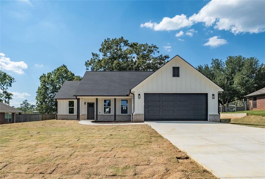 Now offered at $309,000 — standout value in Lindale ISD. Tucked away on a quiet cul-de-sac, this brand-new home delivers the layout, design, and setting buyers are searching for—at a price that’s hard to match. Inside, you’ll find a bright, open-concept floor plan where the living, dining, and kitchen spaces flow seamlessly together. The kitchen is a true centerpiece, featuring a large island, abundant prep space, and a walk-in pantry that actually keeps up with real life. The split-bedroom design creates a private primary retreat, complete with a soaking tub, separate tiled shower, and a spacious walk-in closet. Thoughtful details like built-in storage in the laundry room add everyday function where it matters most. Step outside to a covered patio overlooking a shaded backyard anchored by a mature tree—offering a level of comfort and privacy rarely found in new construction. All of this just minutes from shopping, dining, and within highly sought-after Lindale ISD. If you’ve been waiting for the right combination of price, condition, and location—this is it. Call to schedule your showing today!