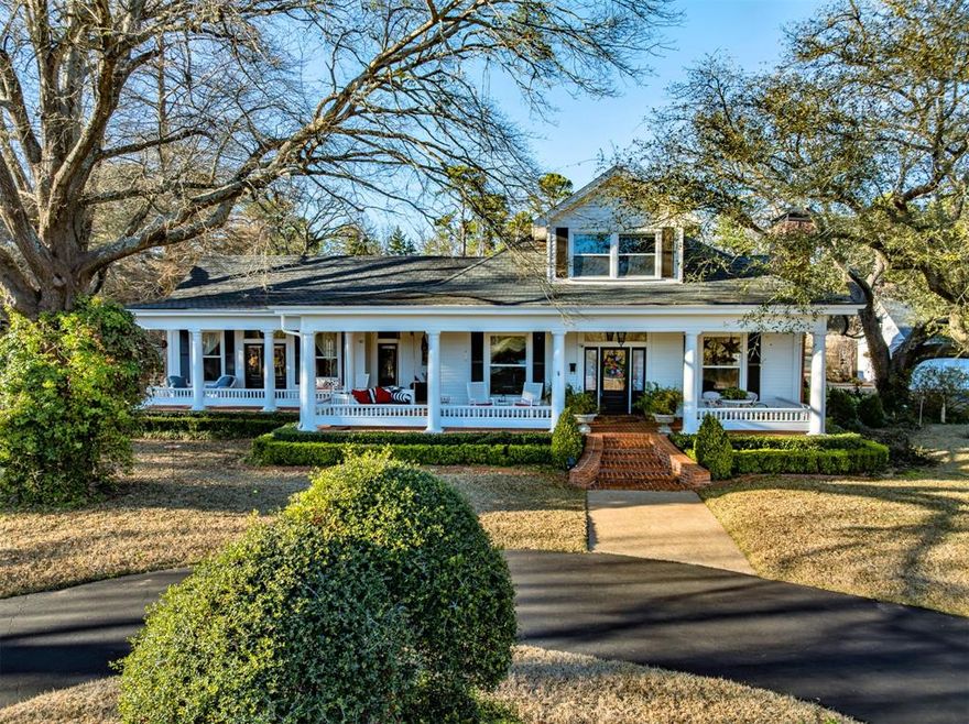 Historic 1908 Home on 22.5 Acres in South Tyler! Originally built in 1908 and relocated from its prestigious corner on Front Street and Bois D'Arc near downtown Tyler, this home has been meticulously renovated while preserving its historical charm. From the entrance gate, you will be mesmerized by your surroundings as you drive through the landscaped grounds, 2 acre pond with fountain and trees to this exceptional home. Situated on a sprawling 22.5 acre fenced estate, this one of a kind property blends timeless elegance with modern convenience. Climb the brick steps to the large wrap-around porch overlooking the pond against a backdrop of 1100 pine and hardwood trees. Surrounding the lake, native grasses and wildflowers have been planted, which attracts wildlife including bald eagles, herons, ducks, doves, purple martins and butterflies. The main residence offers 4 bedrooms, 4 bathrooms, & 3 fireplaces (2 convertible to wood burning). Downstairs includes a formal living & dining room, an open family room with dining area and gourmet kitchen, office, & exercise room. A large primary suite was added to the first floor, blending seamlessly with the design and historical integrity of the original home. Renovations included electrical, plumbing, & foam insulation, while updating the entire interior of the home. Upstairs has a spacious 2nd bdrm with ensuite bath & 2 add'l bdrms with Jack & Jill bath. The resort style backyard boasts a large pool, hot tub, cascading waterfalls, pool cabana, large patio and lush landscaping. Adjacent to the home is a detached 2 car garage with a workroom & greenhouse. Further down the driveway, but still across from the pond, is a 4 stall horse barn with outdoor wash rack, tack room, & storage plus heated & cooled kitchenette & laundry & bath. A charming attached 1000 sq.ft. guest house with a private porch is perfect for family & friends. This is a MUST SEE for those seeking elegance, tranquility, & space in the heart of East Texas!