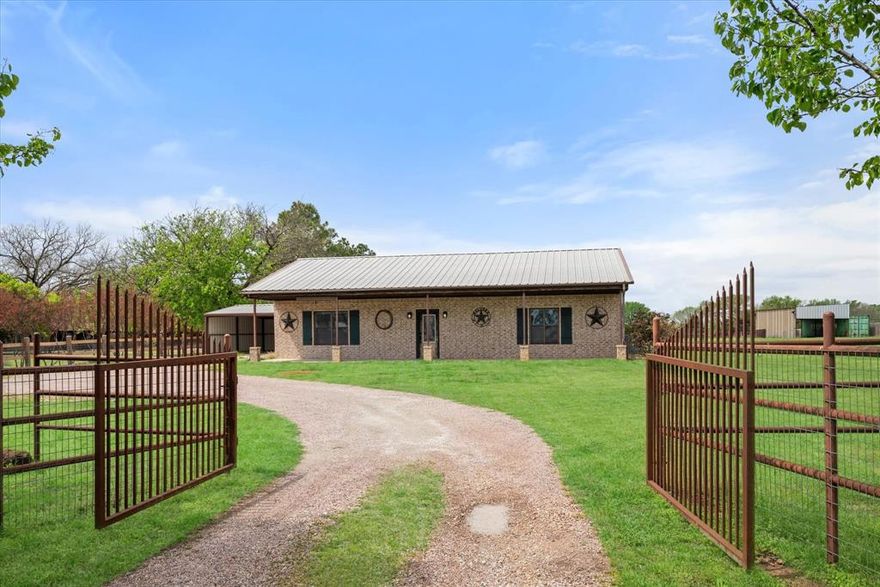 Welcome to your slice of Texas country living! Nestled on a little over 6 acres, this beautifully maintained property offers the perfect blend of comfort, functionality, and wide-open space. The land is fully fenced and cross-fenced, making it ideal for livestock, horses, or simply enjoying the peaceful countryside. You’ll also find a storage shed, open air barn with water and electric, and lean-to shelter. This provides plenty of room for equipment, hobbies, or additional storage. The charming home features 2 spacious bedrooms and a thoughtfully designed layout with LVP flooring throughout for durability and easy maintenance. The large kitchen is a standout, complete with beautiful custom cabinets, ample storage, and a center island, perfect for cooking and gathering. Just off the kitchen, a generously sized utility room adds extra convenience and functionality. The spa like bathroom offers a large walk-in shower, creating a comfortable and modern retreat. Enjoy your morning coffee on the expansive covered front porch, or unwind in the evenings on the back porch overlooking the pasture, where you can take in peaceful views and Texas sunsets. Whether you’re looking for a small ranch, a quiet homestead, or room to grow, this property offers endless possibilities just minutes from town. Enjoy the short drive to Ray Roberts state park for weekend recreational activities. This property will not disappoint!