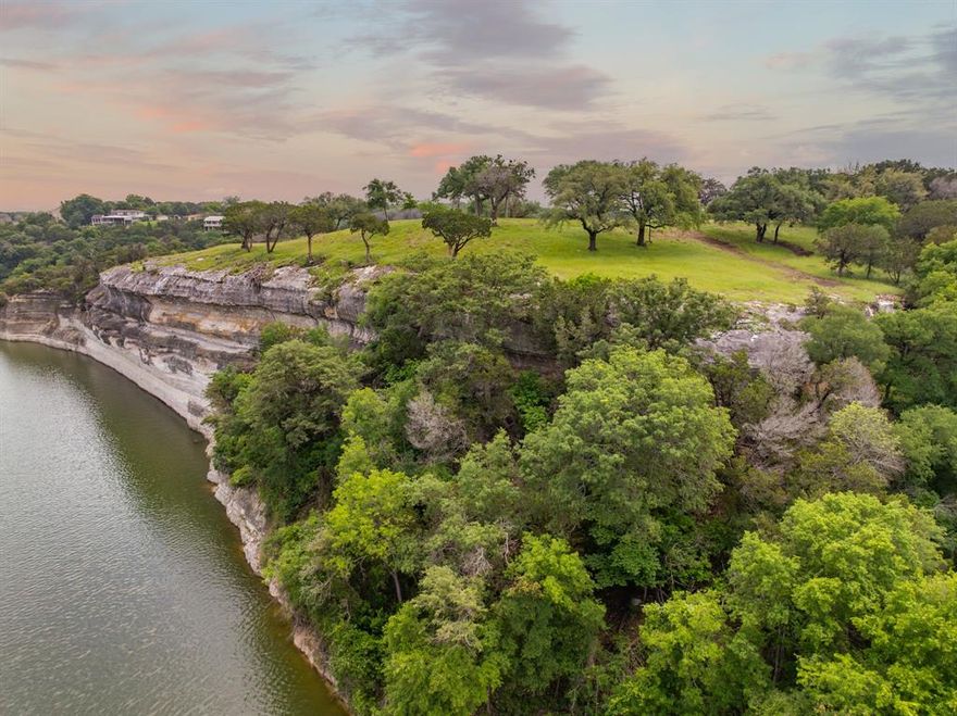 Rare Lake Whitney Homesite in Bosque County, Texas 

An exceptional opportunity awaits with this rare offering—a panoramic lakefront homesite on the Bosque County side of Lake Whitney. Spanning approximately 7 acres, this historic property has been in continuous family ownership since the late 1870s and is the original Owen Ranch Headquarters site. Set on the headwaters of King Creek, the land offers elevated, unobstructed views of Lake Whitney’s western shoreline.
This is an ideal setting to build your dream lakefront home, vacation getaway, or legacy estate. With its size and natural features, the property also presents potential for a custom home builder or developer to design a private retreat or subdivide for multiple lake-view homesites.
Adding to its uniqueness, the land overlooks a pristine, undeveloped 146-acre peninsula in the Owen family. This ensures your views stay protected from future development, preserving the natural beauty and peaceful surroundings for years.

The newly developed Whitney Ridge Marina is just a few miles from the property—a premier facility offering 200 covered boat slips with hydrohoist options and lease-to-own availability. The marina features nightly and yearly slip rentals, dock box storage, a fully stocked ship store, on-site fuel, three boat ramps, a fishing pier, and daily and annual boat ramp passes. A food truck rounds out the marina’s offerings, making it an ideal launch point for lake days and weekend adventures.

Whether you're a buyer looking to create a personal sanctuary or a builder seeking a one-of-a-kind development opportunity, this rare lake lot property offers history, privacy, and stunning views in a desirable location.

The property is equipped with site utilities, including electricity and a shared water well system, but it requires a private septic system. Concessions are granted for the installation of private wells and septic systems.