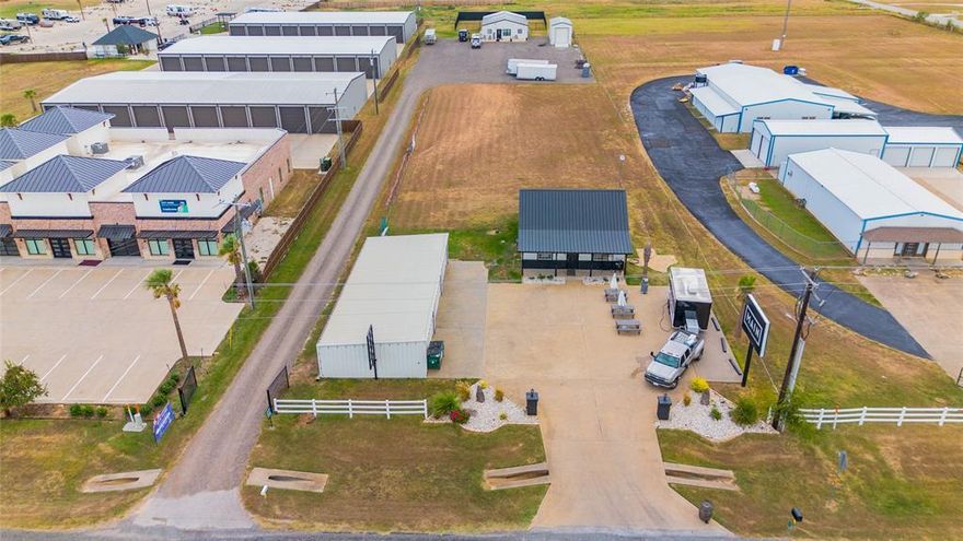 Opportunity Knocks! Purchase office space or a residence in a prime development area across the road from White Bluff Resort! Outside the city limits of Lake Whitney with no zoning. Fiber internet! 60x24 foam insulated climate controlled garage-shop.  Attractive entrance with a large sign for your business name, parking spaces, and landscaped. Former uses have been a builder's office, real estate firm and now a multi-business use.  Setup could easily accommodate a living quarters with a living room, dining room, 2 bedrooms, 2 full bathrooms, full kitchen, and laundry room.  In 2022, the property was completely repainted inside and out and a new AC unit was installed. The owner added a advertising sign with 20 spaces for other businesses to advertise, generating additional income for the new buyers. Almost an acre of land included so there's plenty of room for expansion. Established businesses surround this beautiful property!  Come take a look!