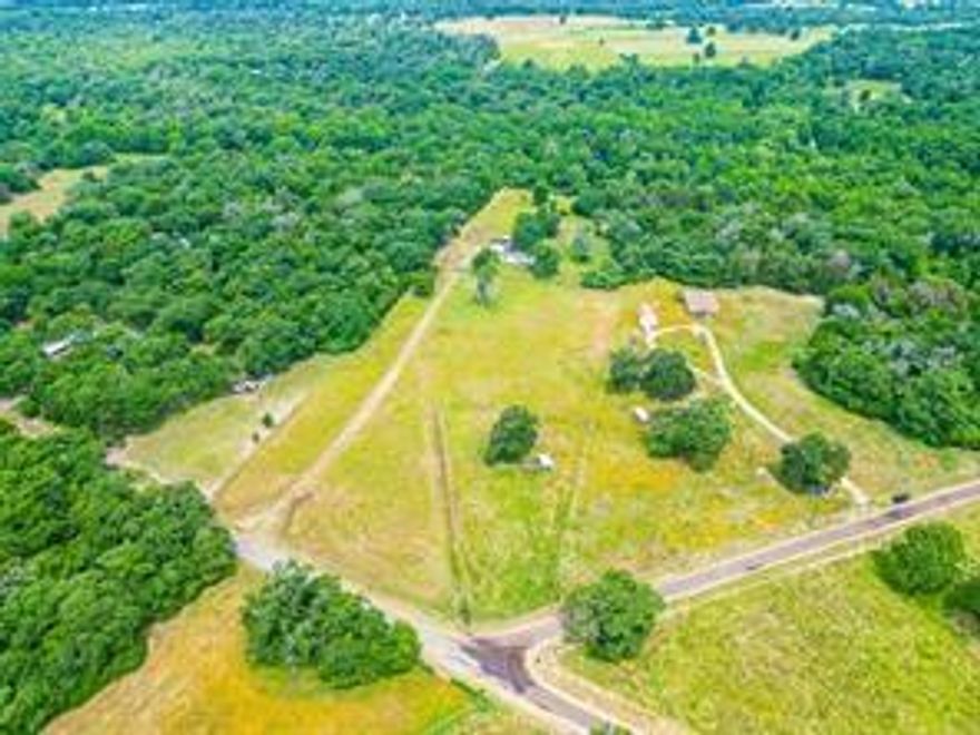 Unrestricted acreage and a humble place to call home is waiting for you here in Freestone County! Enjoy 5 acres, you'll find this property provides both peace and tranquility with natural wooded surroundings, deer and abundant wildlife. The home is a 2 bedroom, 1 bath and features an open living space with plenty of room for everyone.  You'll also find a carport with electric, and storage shed. Enjoy your morning coffee from the back porch which overlooks the property and all the nature.  Come take a look today!