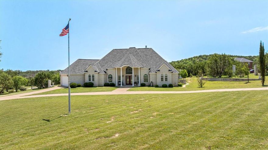 This 2 acre property has it all and NO HOA! Custom built 3 bed, 2 bath, plus bonus room home with a breathtaking drive up, and circle drive. 2 car attached garage has 220 electric and 50 amp RV outlet PLUS there is a huge detached 1800 sq ft 30x60x12 heated and cooled insulated shop with 3 roll up doors that has 1 ton elect hoist on I beam roller to stay with property. Enjoy NO WATER BILLS with your very own well with a constant pressure tank and water softener. How about the inside? Fabulous! To start, there is a stunning double door foyer with decorative barrel ceiling that greets your guests as they arrive. Formal dining at the front of the home flows easily to the kitchen. Kitchen features beautiful stained cabinetry with updated quartz countertops, dishwasher new in 2022 and easy care LVP flooring. Oversized pantry is extra roomy offering plenty of options to get those those larger kitchen appliances off the counter and tucked away with all your edible goods. Double ovens make this perfect for entertaining and there is even a butler pantry for extra storage and to use as your coffee or wine bar area. Living room welcomes you and your guests into the heart of the home with an electric fireplace, light and bright colors and tons of natural light. There is a convenient door from the living room out to the outdoor patio for additional guest space and relaxing. Spacious owner's suite with ensuite bath featuring double sinks, separate jetted tub and large walk in shower with no glass to clean. 2 additional secondary bedrooms and full bath. Great floorplan and freshly painted and updated flooring.   Back perimeter offers steel fencing but the yard is not fully enclosed. Installed irrigation system for area around home only. Home has a Stephenville address but is actually closer to Morgan Mill. 27 miles to Granbury and 11 miles to the heart of Stephenville.