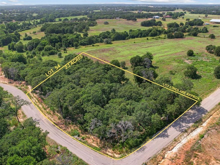 This private corner lot is heavily treed and ready to provide country living like no other. Once hand cleared, the oaks will provide the perfect shade canopy for your estate. The corner lot provides prime accessibility for a future workshop. Unrivaled panoramic views of the rolling topography of Parker County and big Texas sunsets await. At only 35 minutes from Fort Worth and 20 minutes from the growing city of Weatherford, this community is the ultimate blend of country living and convenience. Sarra Ranch Estates offers premium amenities like paved roads, underground utilities, high speed internet. Rare opportunity to enjoy the best of both worlds. Lightly deed restricted and NO HOA! You can bring your own builder and build on your timeline.