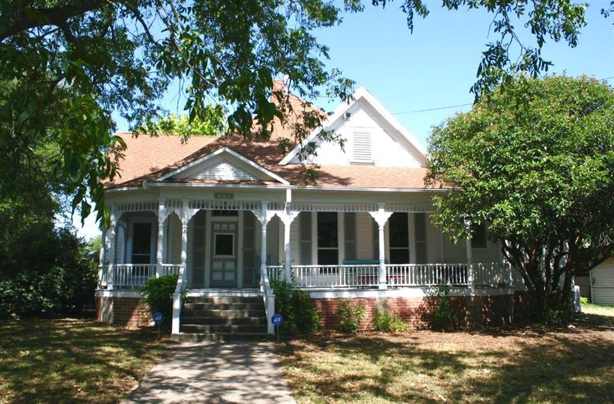 NOTICE: PRICE ADJUSTMENT: This lovely house located at 801 N. Lane is a turn-of-the century beauty! It features 3 spacious bedrooms; each with it's own bathroom and a large living room connected to a dining room. The kitchen is very spacious and is connected to a welcoming seating room. A front porch facing Lane Street has room for several rocking chairs to enjoy the outdoor scenery. The side porch facing Highland Dr. also has room for at least 2-3 chairs! While there has been some updating, the charm of another era is still very much present. The HVAC was installed in 2018 and the attic was sprayed to affect the temperature. There is a one-car carport attached to a large building which has a lovely fireplace and could be renovated for additional living space. Lots of storage. A fenced backyard is accessed from the kitchen and a moderate size porch. Be prepared to fall in love with this unique home. Lockbox on side porch post on the right. Call agent for code.
