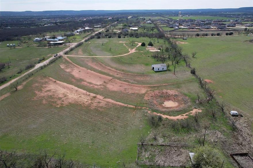 2.06 acres in the sought after Wylie School District in the heart of Potosi. There is an approx. 30x40 shop on the property with concrete floors and large bay opening. This property is on the end of a dead-end road and surrounded by hay fields and country living. This tract has been approved for Potosi water meter, has electric at back of property and there is a set of deed restrictions to help maintain property value. Mobile homes are allowed. Plat on-hand. More acreage available. **Buyer's representative to verify all measurements, utilities, and school districts.