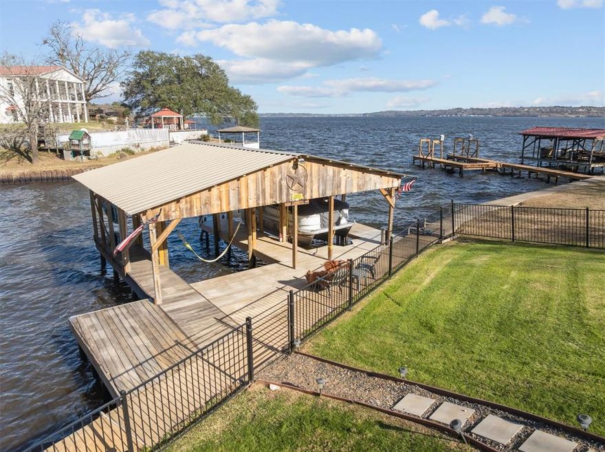 Lake Life Starts Here!
Wake up to beautiful Lake Palestine views from this updated 3-bedroom, 2-bath waterfront home designed for relaxing, entertaining, and soaking up the good life. From morning coffee to sunset evenings, the spacious patio is the perfect place to enjoy sweeping water views and peaceful lake breezes.
Inside, you’ll find thoughtful updates throughout, including a new roof (2025), complete electrical rewire, and a layout that feels both comfortable and inviting.  A 2-car garage provides plenty of space for vehicles, storage, or lake toys, while the storm shelter adds extra peace of mind.  
Step outside and head straight to your brand-new boat dock (2025)—ready for fishing, boating, and endless days on the water. Whether you’re searching for a full-time waterfront home or a weekend escape, this Lake Palestine property delivers views, updates, and lifestyle in one incredible package.
Come see why lake living never goes out of style.