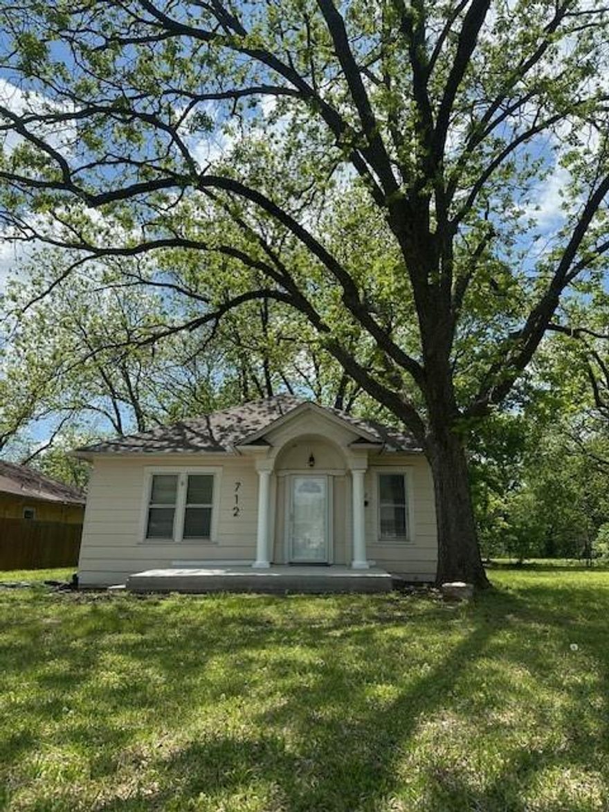 Welcome to this charming 1940's home located on the highly desired Main street, near the heart of historic downtown of Whitesboro.  This home is close to local parks, shopping and churches, with convenient access to major highways.  This delightful home offers the perfect combination of convenience and comfort, making it the ideal place to settle down.  Inside you'll find a cozy living space with new wood look flooring and fresh paint throughout and is waiting and ready for your personal touches.  The property offers an oversized lot with mature trees.  The back yard is perfect for outdoor entertaining and weekend BBQ's with additional room for a garden, play or simply relax.  The outdoor space has endless possibilities.  Homes like this are hard to find!  Embrace the charm of small town living and schedule a tour today.  Don't miss out on the opportunity to own an amazing home on historic Main street.