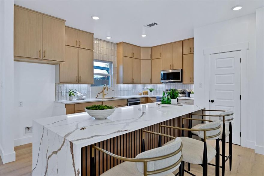 Welcome to 414 Wilson St. — a beautifully designed custom-built new construction home in one of McKinney’s fastest-growing and most desirable areas. Just minutes from Historic Downtown McKinney, this location offers the perfect blend of small-town charm, entertainment, dining, and future growth potential.

Positioned less than 10 minutes from downtown, this home is also conveniently located near the future McKinney National Airport expansion and the highly anticipated new McKinney amphitheater currently under development — making this an exciting opportunity for both homeowners and long-term investment value.

Inside, this stunning 4-bedroom, 2.5-bath home combines modern design with everyday functionality. The open-concept layout is ideal for entertaining and comfortable daily living, featuring engineered hardwood flooring throughout the main level, soaring floor-to-ceiling kitchen cabinetry, and a show-stopping waterfall island that serves as the centerpiece of the home.

The spacious living area is anchored by a sleek electric fireplace, creating a warm and inviting atmosphere perfect for relaxing or hosting guests.

Designed with efficiency and comfort in mind, the home includes spray foam insulation throughout, helping maintain year-round comfort while lowering energy costs.

Upstairs, you’ll find a versatile loft space perfect for a home office or play area. Carpet is thoughtfully limited to the bedrooms for added comfort, while the remainder of the home maintains a clean, modern aesthetic. The upstairs bathrooms feature elegant waterfall countertops, adding a luxurious designer touch.

And for everyday convenience, the upstairs laundry room makes household tasks easier and more efficient.

This move-in-ready custom home offers the perfect combination of quality craftsmanship, thoughtful design, energy efficiency, and close to everything McKinney has to offer. Opportunities like this in a rapidly growing area don’t last long.