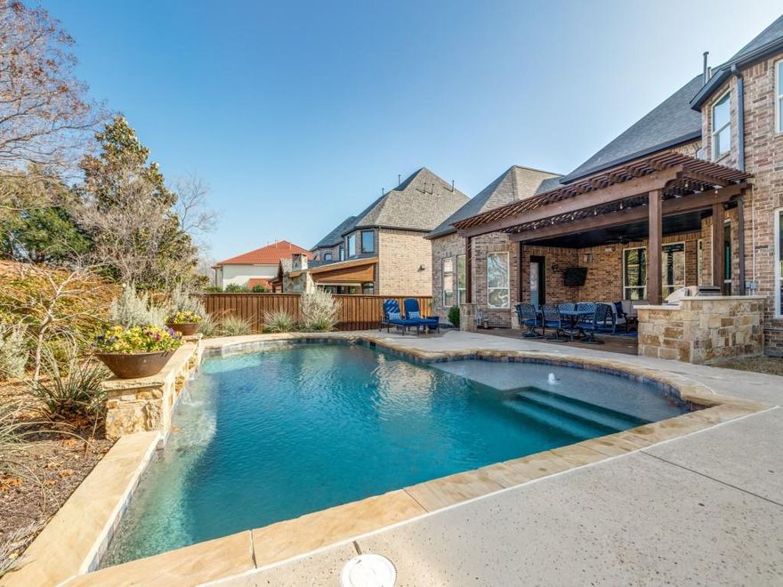 Back on market - buyer decided not to relocate.  Welcome home to this meticulously maintained one owner residence in the highly desirable Saddleridge in west Allen. This community is ideal for those that want an effortless commute to the airports and work with easy access to Hwy 121 & 75.  Built by renowned Toll Brothers, this thoughtfully designed floor plan is perfect for everyday living and grand entertainment.  Updates include quartz countertops and backsplash in the kitchen, painted cabinetry, wood floors extended into the primary bathroom, oversized 3 car garage, an outdoor kitchen and living plus a sparkling pool & built in grill.  Sellers have enjoyed the privacy of not having a neighbors behind the home.  Step inside to traditional elegance with soaring ceilings, a sweeping curved staircase, elegant formal dining, an executive study, floor to ceiling windows, and a beautiful corner fireplace.  All rooms are spacious and bedrooms ensuite. There is an abundance of storage space including extensive walk in floored attic space.  The primary and guest suite are both on the first floor.  Enjoy the community amenities that include a pool, playground, trails, and picturesque ponds. Top-rated Allen ISD. Walking distance to Lifetime Fitness & Cottonwood Creek Trails. Ideal location with easy access to HWY 121, 75, shopping, dining, and entertainment. Don’t miss the opportunity to own this one-of-a-kind luxury residence that truly has it all.