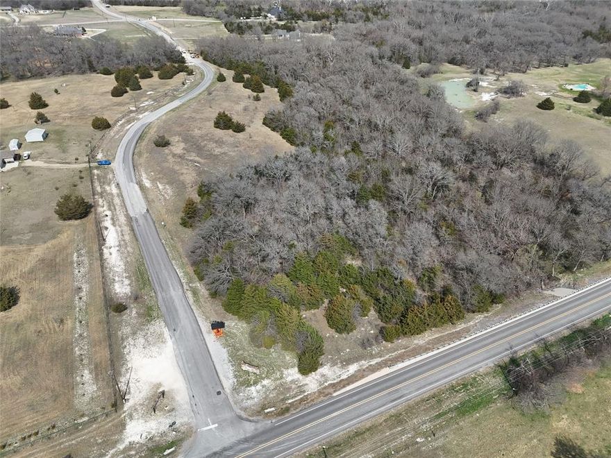 Discover the perfect blend of natural beauty and convenient location on this rare 10.6-acre property in the highly sought-after Sheffield Farms community. Ideally situated just minutes from both North Central Expressway and Highway 121, this corner scenic tract offers the peaceful charm of the countryside while keeping you close to everything you need.

Rolling native grasses, mature trees, and a seasonal creek create a picturesque setting full of character and privacy. Whether you envision a private country retreat, a custom dream home, or simply room to spread out and enjoy the outdoors, this property provides a beautiful canvas to make it your own.

Located in one of the fastest-growing areas in North Texas, you can enjoy the quiet of rural living without sacrificing convenience—shopping, dining, and highly rated schools are all just a short drive away. Properties like this are becoming increasingly hard to find in Anna’s countryside. Come walk the land and experience the potential for yourself.