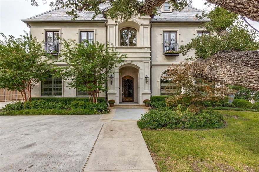 Beautiful French Traditional home on prestigious Park Lane in Preston Hollow is the epitome of quality and meticulous attention to detail. A lovely reimagined courtyard, with a newer pergola and tranquil fountains, welcomes you. Dramatic two-story foyer flows into the great room adorned with vaulted and beamed ceilings, leading to the gourmet kitchen with hidden walk-in pantry. Handsome two-story library with coffered ceilings, built- ins, fireplace pneumatic elevator and a hidden cigar room. The main level showcases a luxurious primary suite with an ensuite bath with a stand-alone tub, separate shower, custom closet, and dedicated utility and exercise room. Upstairs discover a haven of leisure with a game room, media room, craft room, and three additional bedrooms with ensuite baths. Separate from the main home, the front side of the courtyard offers a 430sf guest quarters, not in the total square footage. Electronic gate and fencing with curated landscaping ensure privacy.