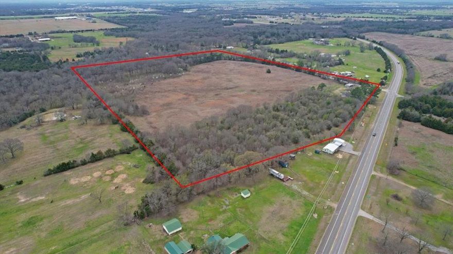 Prime 34-acre property just outside Bonham city limits, offering over 450 feet of frontage on Highway 121 and more than 1,100 feet along County Road 1465. This highly accessible tract is ideal for development or subdivision, with ample road frontage providing multiple entry points. The land features a well-maintained 1,500-square-foot brick home built in 1976, offering a solid foundation for a residence, rental, or sales office. Whether for residential or commercial development, this property presents a rare opportunity in a rapidly growing area.