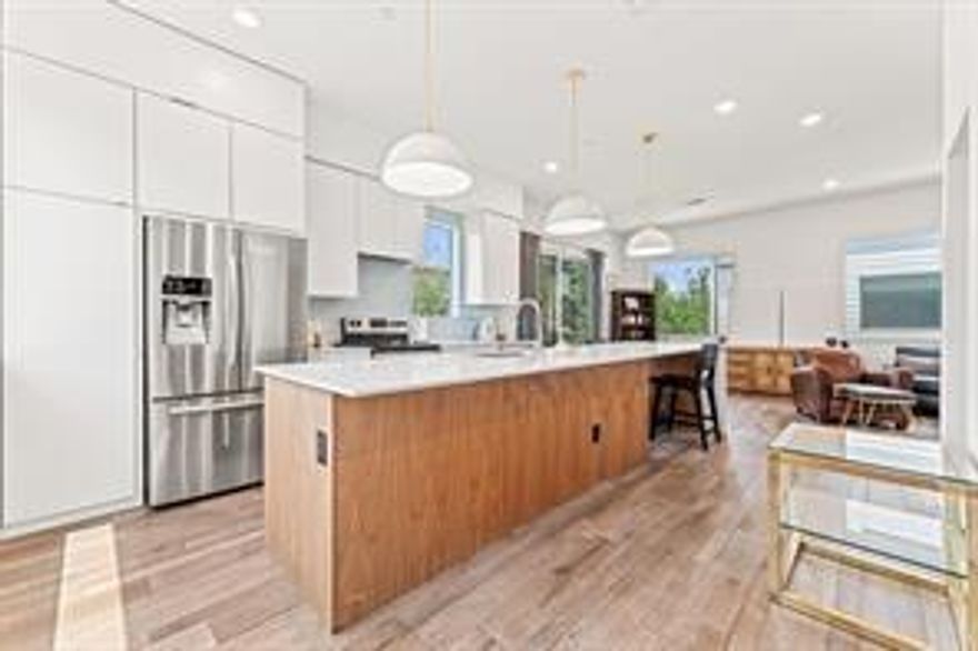 Sleek. Stylish. Steps from the Action.
Live in the heart of it all in this show-stopping modern corner townhome, perfectly situated just one block from Lower Greenville Ave., Henderson Ave., and Garrett Park—offering unbeatable access to some of Dallas’s best dining, shopping, and nightlife. Plus, you're just minutes from the vibrant energy of Downtown Dallas, making work and play effortlessly accessible. This 2-bedroom, 2.5-bath residence delivers designer style, skyline views, and a lifestyle that blends luxury with walkable urban convenience. Step inside to a bright, open-concept layout filled with natural light from expansive windows. As a desirable corner unit, the home feels airy and private. The chef-inspired kitchen is a true centerpiece, featuring a massive center island, sleek cabinetry, premium appliances to include refrigerator. Cant miss these unforgettable views of Downtown Dallas right from your kitchen window. The spacious living and dining areas flow beautifully for entertaining, while upstairs, both bedrooms are privately located on the third floor—each with its own ensuite bath and ample closet space. Modern finishes, an oversized two-car garage. Whether you're enjoying peaceful evenings in or exploring the city just outside your door, this home offers the perfect fusion of style, comfort, and location in one of Dallas’s most desirable neighborhoods. Water, trash and sewer included in the HOA!