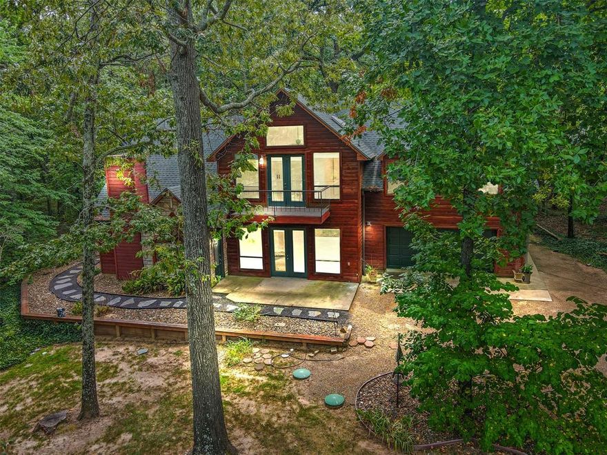 Charming Cedar & Stone Home on Double Lot over 1 acre in Gated Pine Valley – Lake Views + Modern Updates! 
Welcome to this beautifully updated 2-story cedar and stone home nestled in the serene, gated Pine Valley subdivision. Situated on a large, heavily wooded lot, this 4-bedroom, 3.5-bath home offers 2,544 sq ft of rustic charm blended with thoughtful modern touches — all just steps from lake views across the street. 
Interior Highlights: Stunning stone wood-burning fireplace in the main living area 
Wall of windows offering panoramic views of the surrounding woods & lake views 
Fully updated kitchen with custom-molded stainless countertops, sleek green cabinetry, and stainless steel appliances 
Two spacious primary en suites for multi-generational living or guest comfort 
Fourth bedroom is a flexible space — perfect for an office, art studio, or second living area 
Additional Features: Fiber optic internet for fast, reliable work-from-home capability 
Workshop space with sink in the attached 2-car garage 
Screened casita for relaxing outdoor living 
Custom outdoor dog-washing station 
Brand new wrought iron fencing enclosing the yard — ideal for kids and pets to safely play 
This home offers privacy, functionality, and a peaceful natural setting with modern upgrades already complete. Whether you’re looking for a full-time residence or a retreat-style getaway, this property is a rare find in one of East Texas’ most beautiful gated communities. Don’t miss the chance to make this unique and versatile home yours — schedule a private showing today!