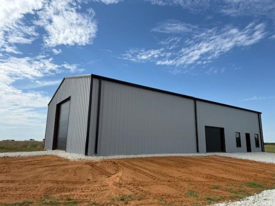 75x40 metal building on 1 acre ready for you to make it....whatever you wish!   No restrictions!  With the tall height of the ceiling, you could easily make this a two-story interior with shop-living space.  The corner 1 acre lot allow plenty of additional space to build another structure. Think?, live in the metal existing structure while building your dream home on the same lot.  Or, make this the ultimate barndominium home.  So many possibilities for you to conjure up.    Bring your creative thoughts and vision out to this property and make it yours.   Water and electricity available on road front.  Maybe store your RV while deciding what to do with the lot.  Again, no restrictions.