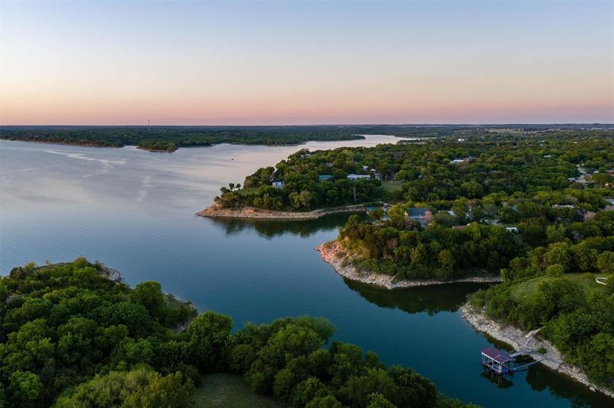 What an incredible opportunity — two charming lake houses on beautiful Lake Whitney!
House #1 offers a spacious 4-bedroom layout plus a study, two inviting living areas, and an open loft perfect for relaxing or entertaining. House #2 is equally delightful, featuring 2 bedrooms and a bright, open Great Room that captures the easy flow of lakeside living.

Both homes are currently successful short-term rentals, making this not just a retreat, but an investment opportunity. Step outside to enjoy generous outdoor living spaces ideal for morning coffee, sunset dinners, or simply soaking in the tranquil lake views.

From your property, wander down an easy path to the water — launch your boat, cast a line, or take a dip right from the shore. Whether you’re seeking a personal getaway, a family compound, or dual rental income, these two houses create a private resort experience all your own.