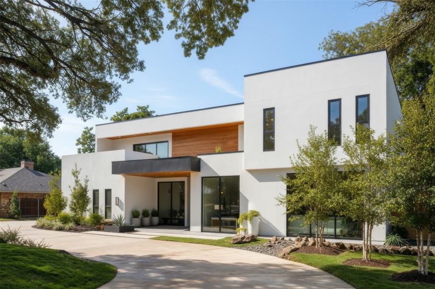 Exquisite steel-frame construction on the coveted Northwood Club Golf Course in North Dallas. This modern luxury home is crafted with soaring ceilings, designer lighting, and high-end finishes throughout, offering an unparalleled blend of modern elegance, comfort, and style. The home features two lavish primary suites and three additional ensuite bedrooms, with two bedrooms conveniently located on the main level, providing a versatile layout ideal for family living or hosting guests. The chef's gourmet kitchen is showpiece, featuring luxury appliances, a spacious butler's kitchen, and custom cabinetry, perfect for culinary creativity and entertaining. Expansive living and dining areas flow seamlessly to covered balconies and outdoor living spaces, creating a natural connection between indoor luxury and outdoor leisure. Additional features include a private home office with floor to ceiling storefront windows overlooking the front yard. Step outside to your resort-style backyard, offering a large pool, outdoor kitchen, and expansive entertaining spaces with breathtaking views of the private golf course. A grand circular driveway and oversized three-car garage provide both convenience and curb appeal. Built with a durable steel frame, this home combines modern design, luxurious finished, and Northwood Club's prestigious golf course location, creating a rate opportunity to experience timeless elegance, sophisticated living, a premier North Dallas lifestyle.