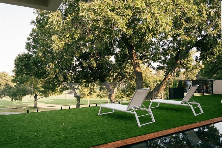 Exquisite steel-frame construction on the coveted Northwood Club Golf Course in North Dallas. This modern luxury home is crafted with soaring ceilings, designer lighting, and high-end finishes throughout, offering an unparalleled blend of modern elegance, comfort, and style. The home features two lavish primary suites and three additional ensuite bedrooms, with two bedrooms conveniently located on the main level, providing a versatile layout ideal for family living or hosting guests. The chef's gourmet kitchen is showpiece, featuring luxury appliances, a spacious butler's kitchen, and custom cabinetry, perfect for culinary creativity and entertaining. Expansive living and dining areas flow seamlessly to covered balconies and outdoor living spaces, creating a natural connection between indoor luxury and outdoor leisure. Additional features include a private home office with floor to ceiling storefront windows overlooking the front yard. Step outside to your resort-style backyard, offering a large pool, outdoor kitchen, and expansive entertaining spaces with breathtaking views of the private golf course. A grand circular driveway and oversized three-car garage provide both convenience and curb appeal. Built with a durable steel frame, this home combines modern design, luxurious finished, and Northwood Club's prestigious golf course location, creating a rate opportunity to experience timeless elegance, sophisticated living, a premier North Dallas lifestyle.