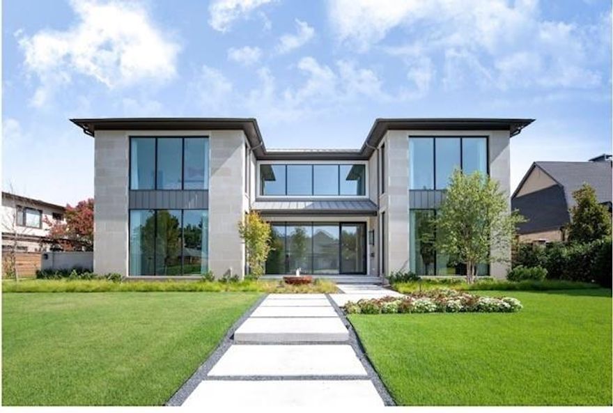 Experience the epitome of luxurious living in this stunning Preston Hollow masterpiece, crafted in 2022. Designed by the owners and Ikemire architects & styled by Morgan Farrow Interiors, this home is a true sanctuary of modern elegance & sophisticated comfort. Built by Knox Built with landscape design by DDLA. Step inside to discover soaring 11-foot ceilings & expansive floor-to-ceiling windows that flood the space with natural light, creating an airy, welcoming atmosphere. The interior is a seamless blend of opulence & warmth, featuring exquisite materials like gleaming white & black marble, rich wood accents, & textured walls that evoke a sense of cozy indulgence. Custom wallpaper, designer lighting fixtures, & a striking wood wall add personal touches of artistry throughout. The chef’s kitchen is a culinary dream, boasting a massive 17-foot island with hidden storage, state-of-the-art Wolf and Sub-Zero appliances. Indulge in the spa-inspired master suite, complete with a fireplace, dual vanities, an oversized steam shower, heated marble floors, & an expansive walk-in closet illuminated by LED lighting on every shelf. Entertain effortlessly in the resort-style backyard, where a shimmering pool, bubbling spa, fire pit, & outdoor kitchen beckon for gatherings under the stars. Glass doors slide open to seamlessly merge indoor & outdoor living.. The backyard also features a lush turf area, electronic pool cover for safety & temperature control. Additional highlights include a 3 car garage, downstairs guest suite with private bath, & an upstairs retreat featuring a game room, wet bar, kitchenette, & multiple bedrooms with full baths & second laundry room. Close to elite private schools, stylish retail shops, and cozy coffee spots. This exceptional home is a perfect sanctuary for entertaining & everyday living, combining cutting-edge technology with luxurious details & meticulously curated materials throughout. This is more than a home; it’s a lifestyle of luxury.