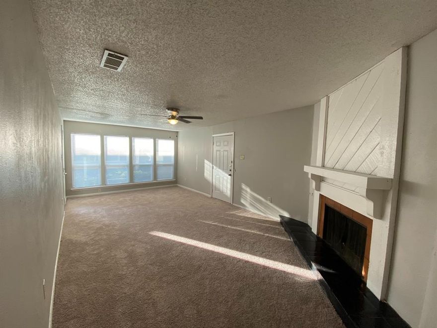 Charming 1 bedroom 1 bath updated condo on the 1st floor. This home features a spacious living area with a fireplace, patio, oversized bedroom with a walk in closet, and laundry connections in the unit! Unit has dishwasher, electric range, and refrigerator. The Trinity Meadows Condominiums is conveniently located near restaurants, shopping, and several major freeways. Long term tenant in place with current lease expiration of March 31, 2027 at $940 per month.