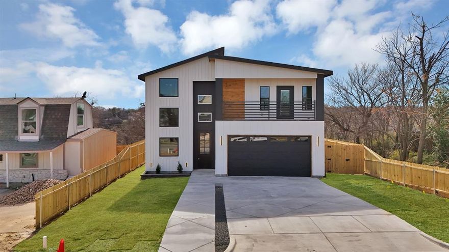 Experience refined modern living in this stunning three bedroom, two and a half bath residence offering 2,056 square feet of thoughtfully designed space just minutes from downtown Fort Worth and the stockyards. Soaring 20 foot ceilings create an impressive sense of scale and light, perfectly complemented by elegant chandeliers and designer ceiling lighting throughout. The heart of the home features a chef's kitchen with a statement island, custom cabinetry, and sleek finishes ideal for both entertaining and everyday living. The tile flooring throughout delivers a clean, contemporary aesthetic and effortless maintenance. A spacious dining area with a stylish dry bar adds an elevated touch for hosting guests. Retreat to the primary suite, complete with custom closet shelving and a spa-inspired feel. Additional highlights include a 2-car garage, beautiful stamped driveway and exceptional curb appeal showcased by a modern, sophisticated exterior design. This home seamlessly blends luxury, functions, and location-offering modern elegance with close proximity to Fort Worth's most iconic destinations.