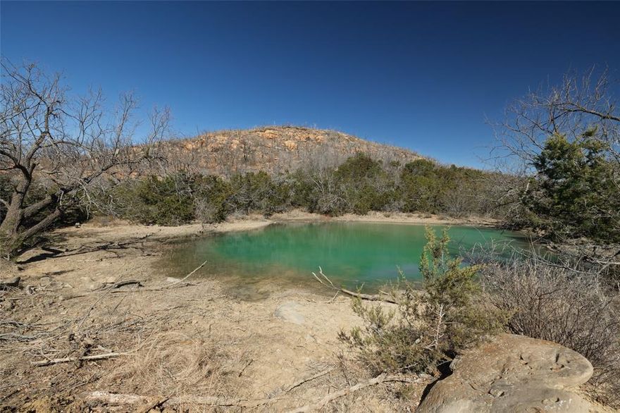 Experience breathtaking beauty on this 320-acre ranch featuring unmatched views of Possum Kingdom Lake. The property showcases dramatic elevation changes, creating a landscape rich in character and visual appeal. Wildlife is abundant, with whitetail deer, hogs, dove, and turkey calling the ranch home—perfect for hunting and outdoor recreation. Two stock tanks provide reliable water sources for wildlife and livestock. A fire several years ago has sparked healthy regrowth, adding to the land’s diversity and long-term potential. With its scenic setting, abundant game, and investment promise, this ranch offers both immediate enjoyment and lasting value for the future.